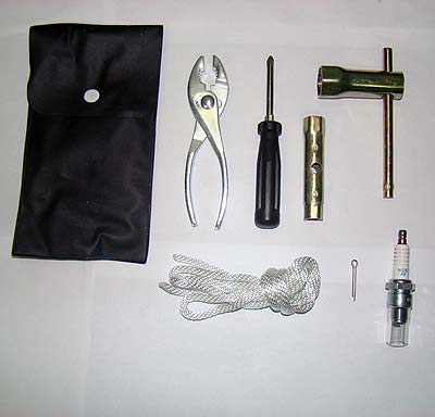 Representative compact boat tool kit with pliers, screwdriver, plug wrench, rope and spark plug